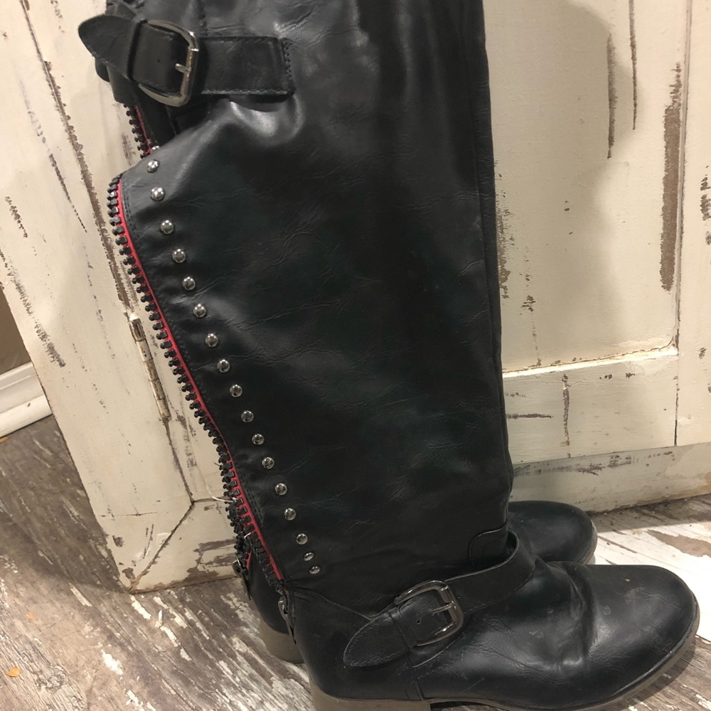 Tall black riding boots